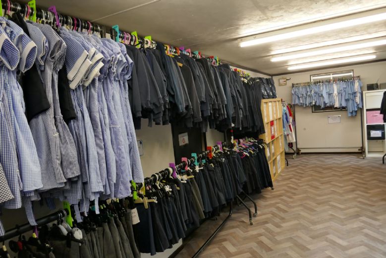 Inside the PTA shop, rails of uniform