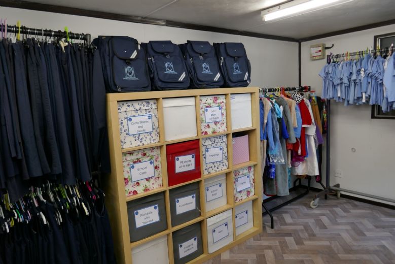 Inside the PTA shop, school bags display