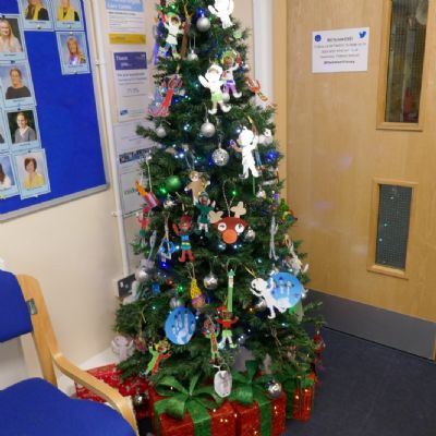 A Christmas tree and ornaments.