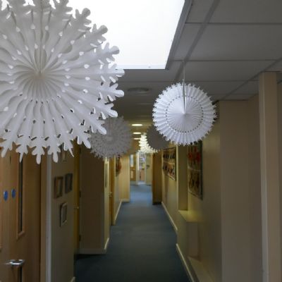 Hanging Christmas decorations.