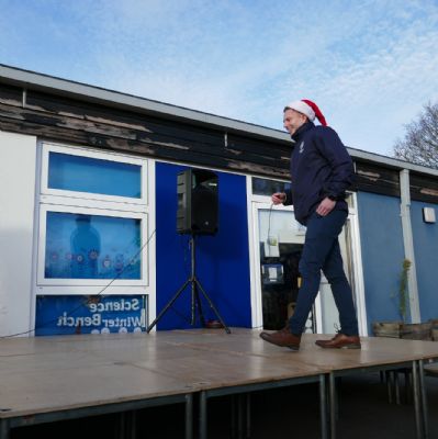 Mr Stevens walking on the stage.